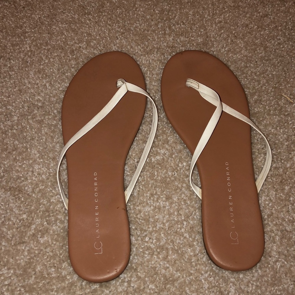 tan and white flip flops